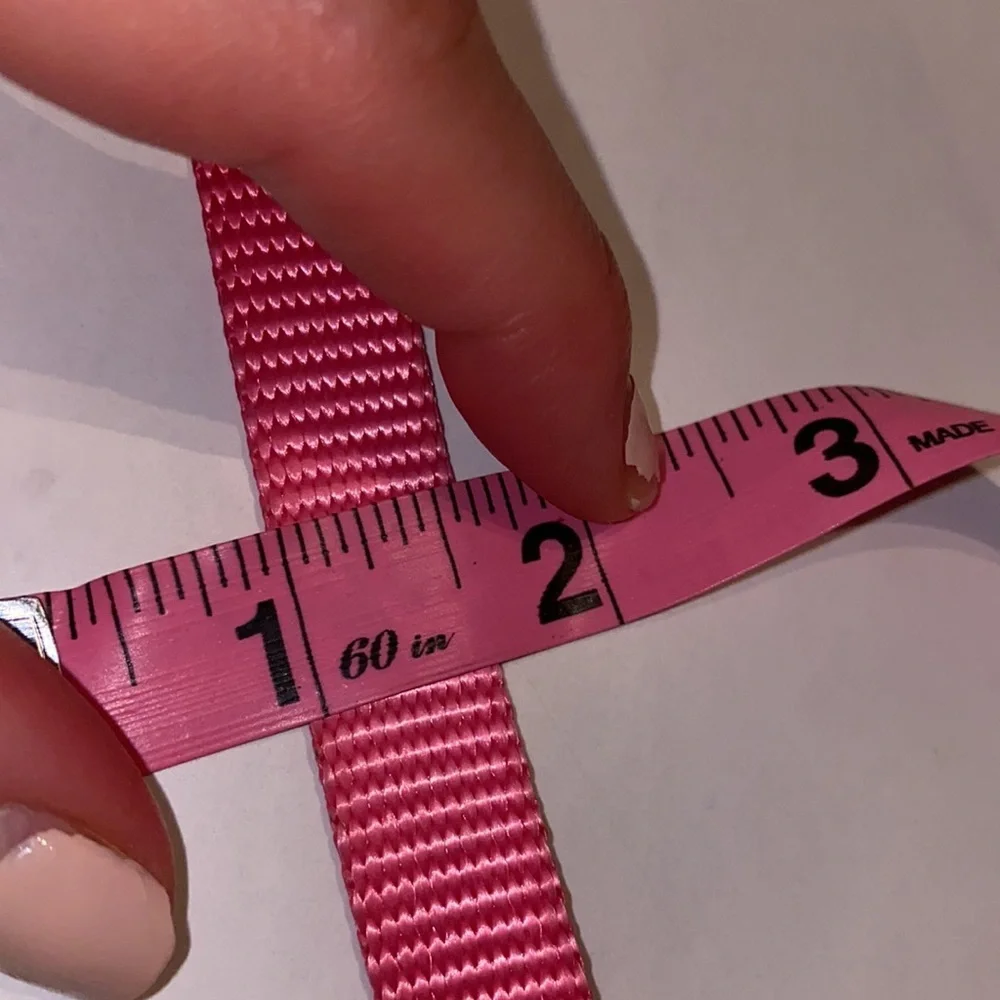 Pink pet collar, adjustable sizing, bright pink, black closure, .5” wide dog cat
